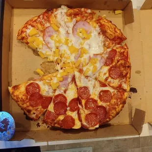 This is how we received our "half and half" pizza. All of the topping smeared sideways.