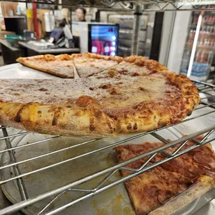 a pizza on a cooling rack