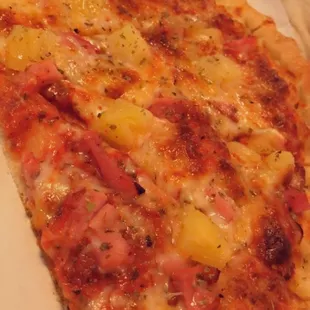 Pineapple ham pizza!  The pineapple and ham are unlike any pizza topping anywhere else!