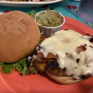 Grilled chicken sandwich with bacon and Monterey Jack cheese, guac in the side. (My friends dipped their garlic parm fries in the guac!)