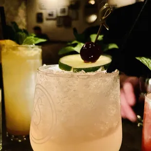 a close up of a cocktail with a cherry on top