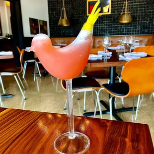 a pink cocktail in a glass