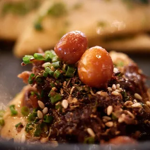 Oxtail hummus, crispy chickpea, curry oil, warm naan