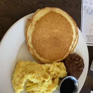 Buttermilk milk pancakes and eggs choice of bacon or sausage.