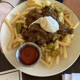 "Hot mess" Short ribs &amp; gravy over fries with poached egg and jalapeños.