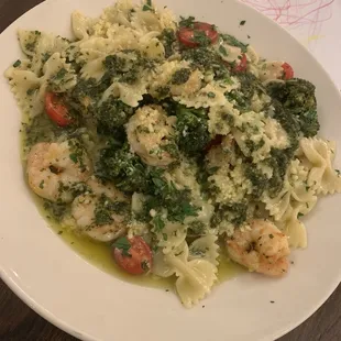 Grilled shrimp with bowtie pasta pesto and broccolini.