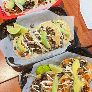 three tacoss on trays