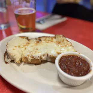 Cheesy bread with tomato sauce