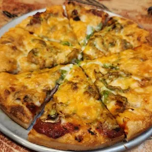 The #5 plus onions. That includes Pepperoni, Canadian bacon, Mushrooms, and Green Peppers. Excellent!