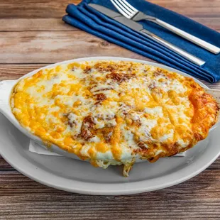 Baked Lasagna: our twist on classic lasagna. Pasta with meat sauce baked to perfection. Served with garlic bread and salad or soup.