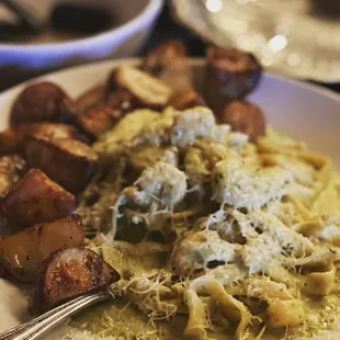 a plate of pasta and potatoes