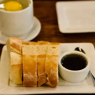  plate of bread and a cup of coffee
