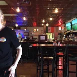 a woman standing in a restaurant