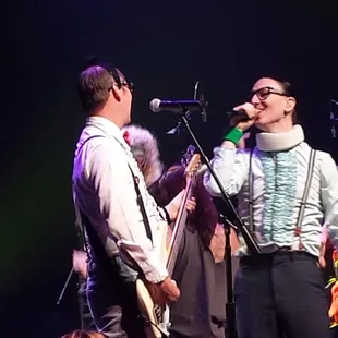 a group of musicians performing on stage