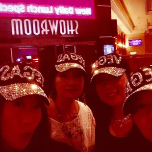 a group of women wearing tiables