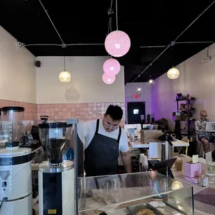 a woman working in a coffee shop