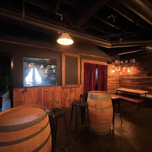 a bar with wooden barrels