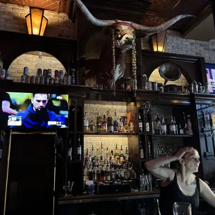a woman sitting at a bar