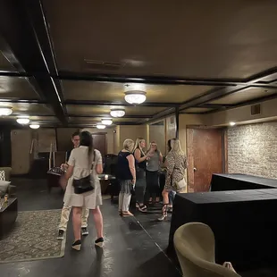 a group of people standing in a room