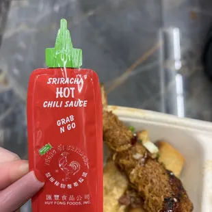 Only perks of the meal. Baby sriracha packet