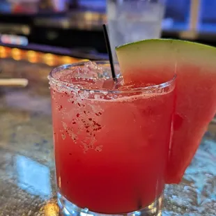 a watermelon drink with a slice of watermelon
