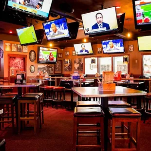 a sports bar with multiple televisions