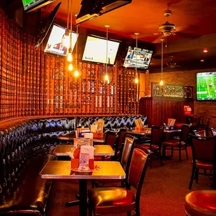 a restaurant with a bar and televisions