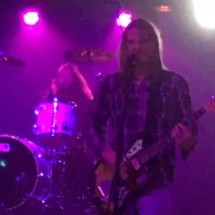 a man playing a guitar