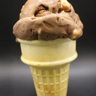 an ice cream cone with chocolate ice cream