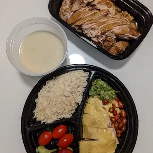 Hainan chicken lunch box combo on the bottom (comes with soup) and the chiu chow braised duck on top.