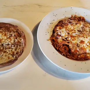 Chicken Parmesan with side of cheese bread which is just a pizza with no sauce.