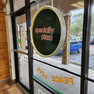 a peace love sign in a window