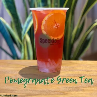 a drink in a plastic cup on a table