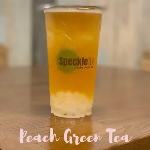 a glass of peach green tea