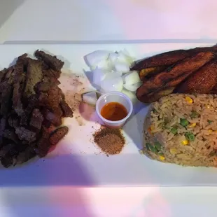 Signature Suya, Friend (Jollof Rice) and Plantains.