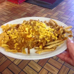 Lt. Sam. Cheeseburger, Fries and Fritos covered with our Chili
