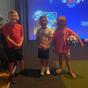 Kids playing the simulator