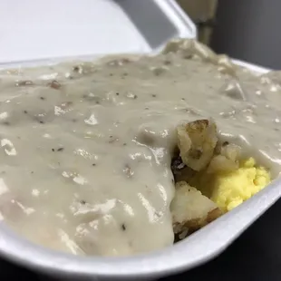 gravy and potatoes in a styrofoam container