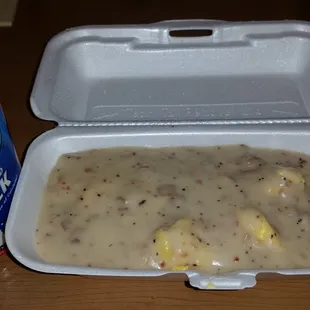 Biscuits and eggs covered in pepper, bacon and sausage gravy.  Yumm.