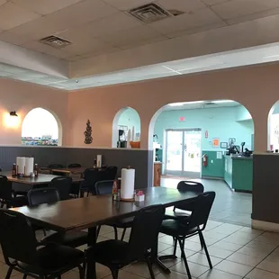 a dining room with tables and chairs