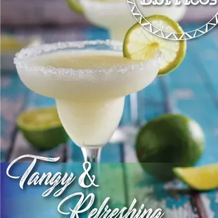 a margarita in a glass with a lime slice on the rim