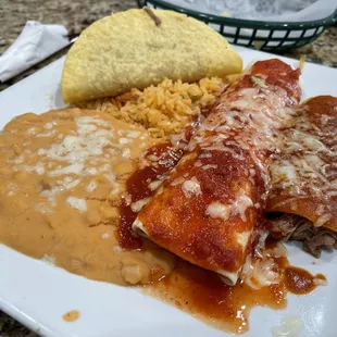 Enchiladas, burrito, taco plate. Number 12 on the menu with shredded beef.