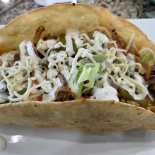 Speedy house taco salad with steak, shrimp and chicken. Not the regular taco salad