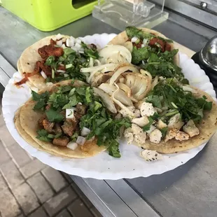 Tacos of pastor, beef fajita and chicken.