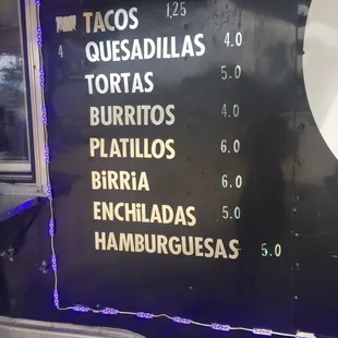 the menu on the side of a food truck