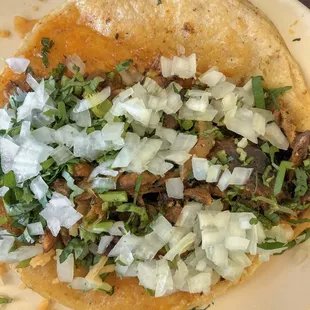 a close up of a taco on a plate