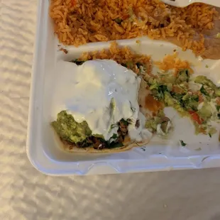 There is a taco somewhere under that slopped on sour cream. Ordered two taco meal. Both were Smothered and not appealing.....
