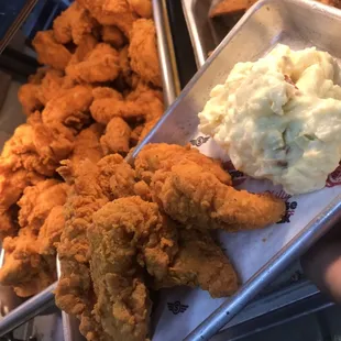 4 piece tender with a side of potato salad