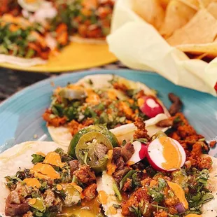 a plate of tacos and chips