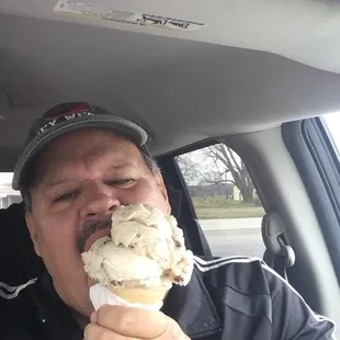 a man eating an ice cream cone